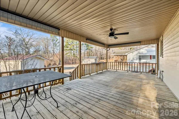a view of a porch with wooden floor