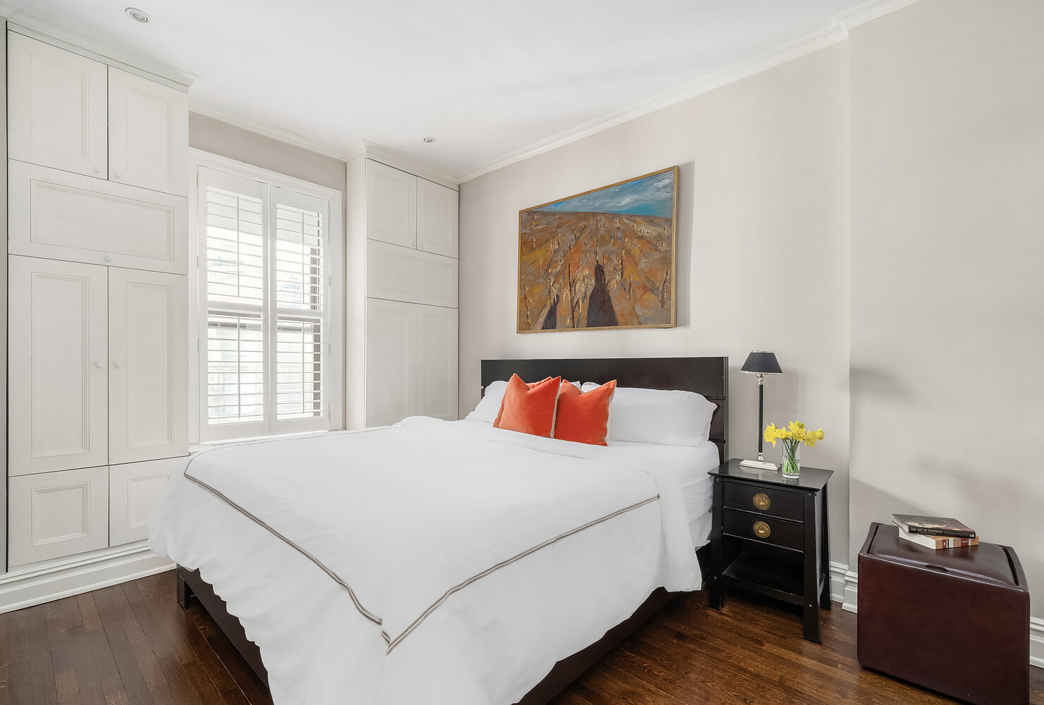 17 East 95th Street, Unit 4R Manhattan, NY 10128 - Photo 4 of 8 a bed sitting in a bedroom next to a window