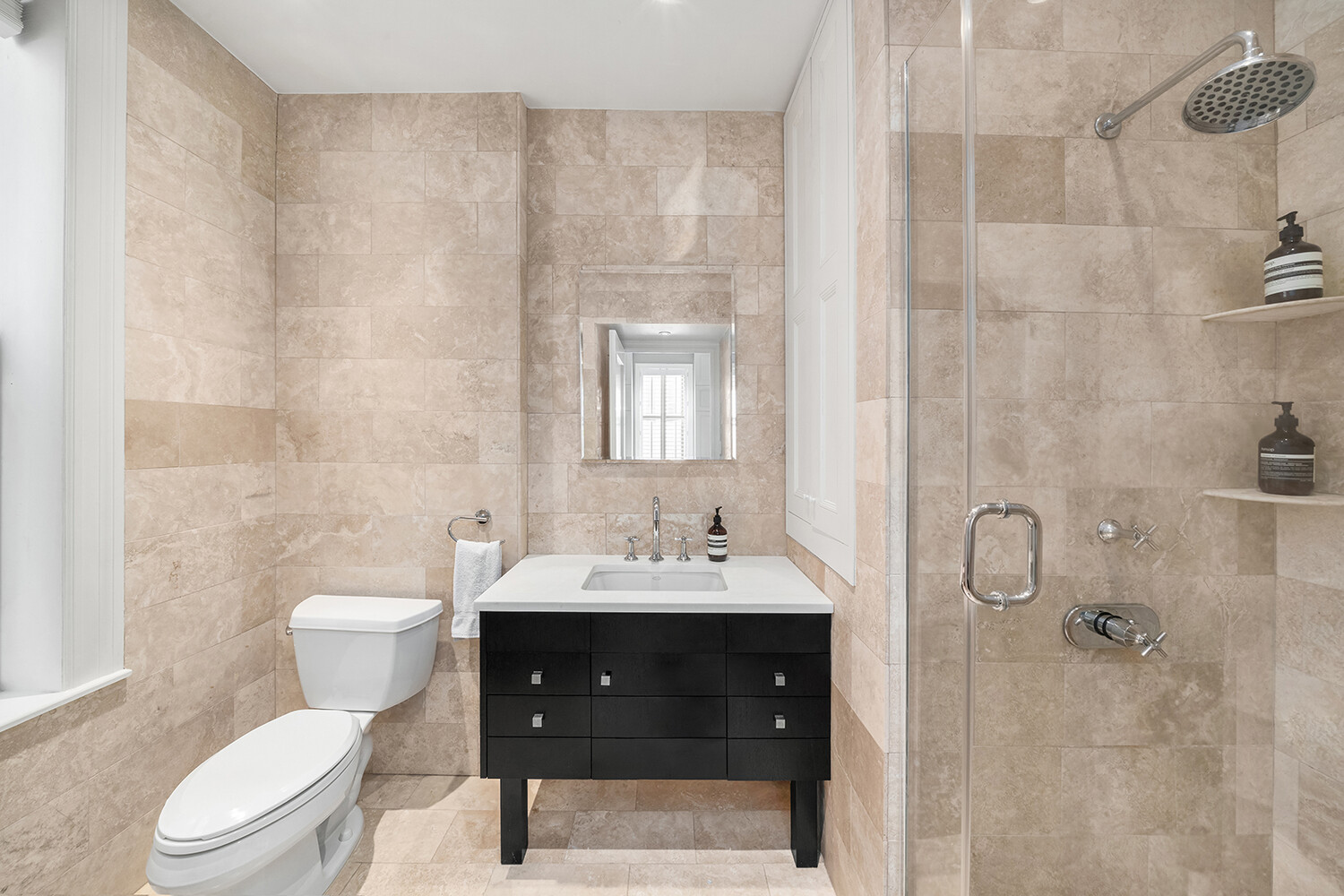 17 East 95th Street, Unit 4R Manhattan, NY 10128 - Photo 5 of 8 a bathroom with a sink toilet and shower