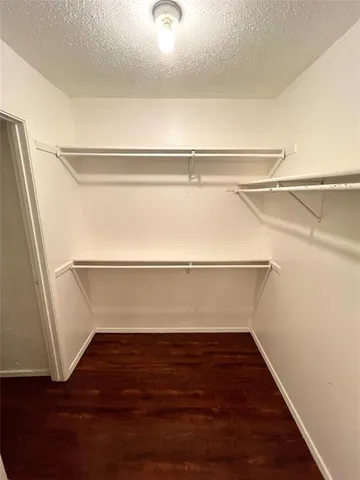 a view of an empty walk in closet