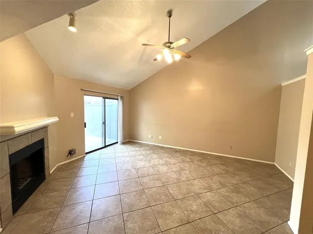 a view of an empty room with a fireplace