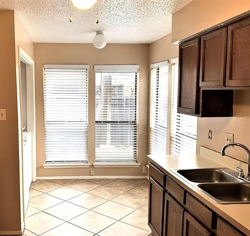 a kitchen that has a sink and a window