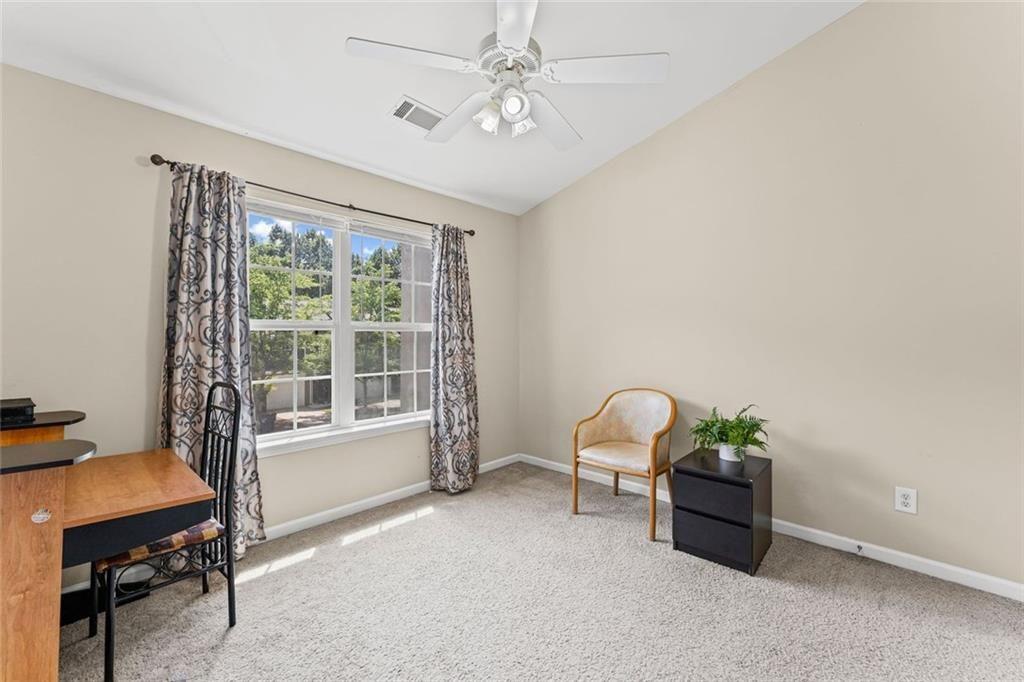 2743 Pierce Brennen Court Northeast Lawrenceville, GA 30043 - Photo 24 of 31 a dining room with furniture and window