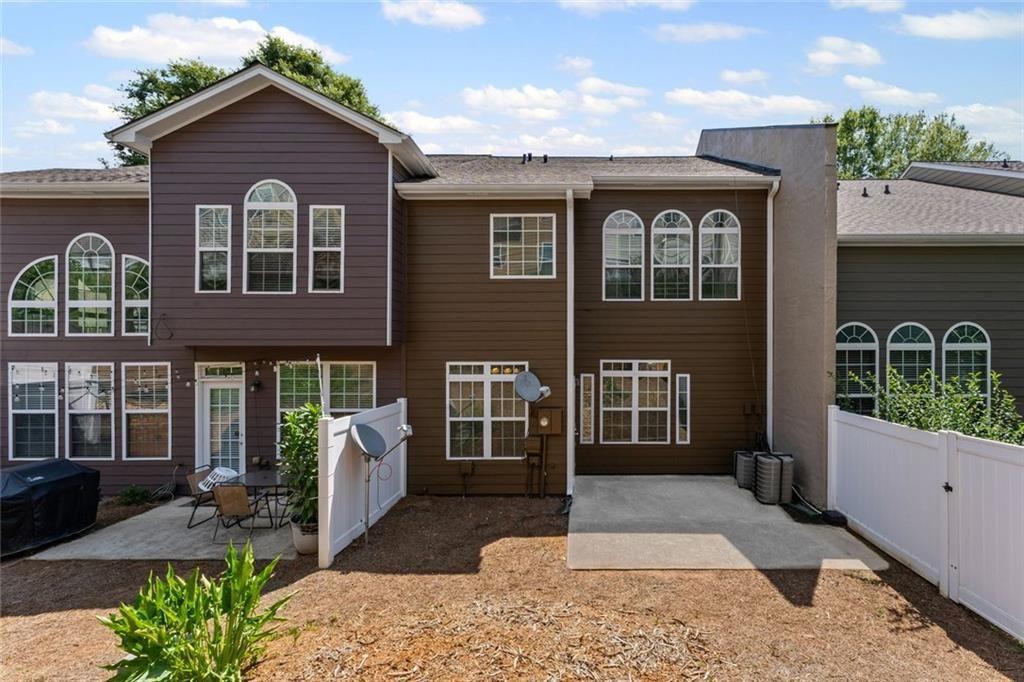 2743 Pierce Brennen Court Northeast Lawrenceville, GA 30043 - Photo 28 of 31 a front view of a house with garden