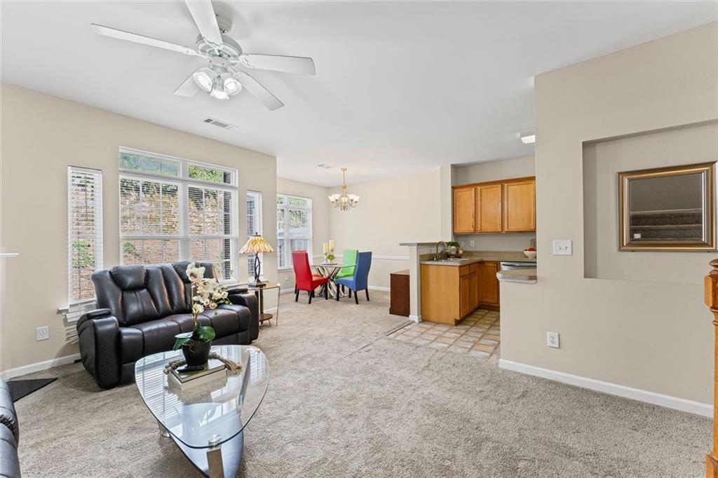 2743 Pierce Brennen Court Northeast Lawrenceville, GA 30043 - Photo 7 of 31 a living room with furniture and a flat screen tv