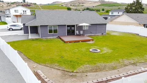 an aerial view of a house with swimming pool