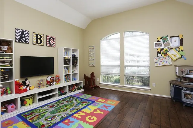 a living room with furniture and a flat screen tv
