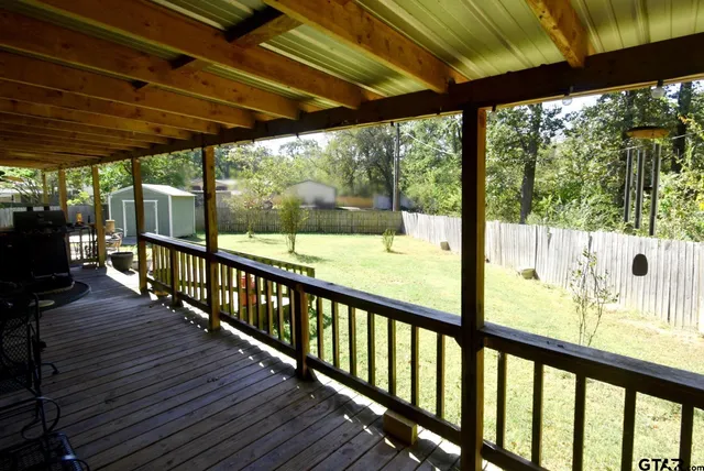 a backyard of a house with basket ball court and a stove