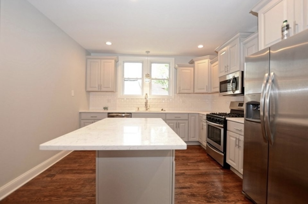 Undisclosed Address Chicago, IL 60628 - Photo 13 of 27 a kitchen with a sink appliances and cabinets
