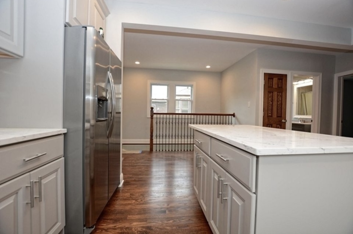 Undisclosed Address Chicago, IL 60628 - Photo 14 of 27 a kitchen with a sink and refrigerator