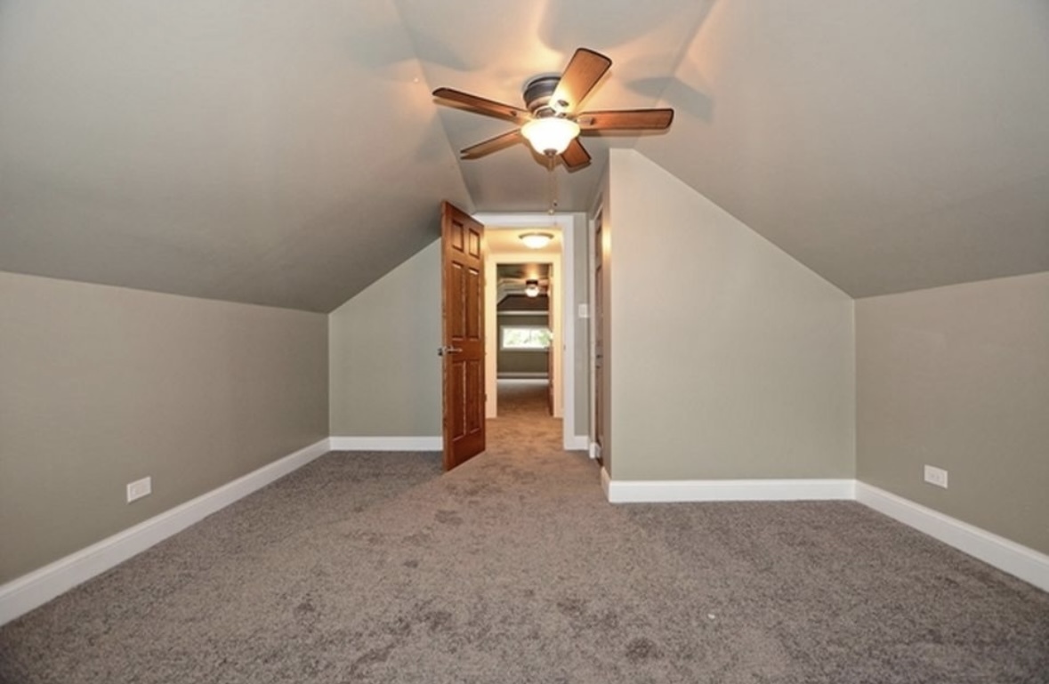 Undisclosed Address Chicago, IL 60628 - Photo 18 of 27 a view of an empty room with a ceiling fan