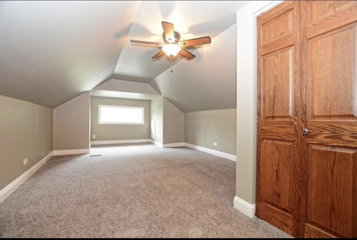 Undisclosed Address Chicago, IL 60628 - Photo 19 of 27 wooden floor in an empty room with a window