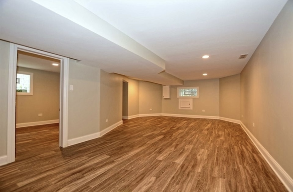 Undisclosed Address Chicago, IL 60628 - Photo 23 of 27 a view of an empty room and wooden floor