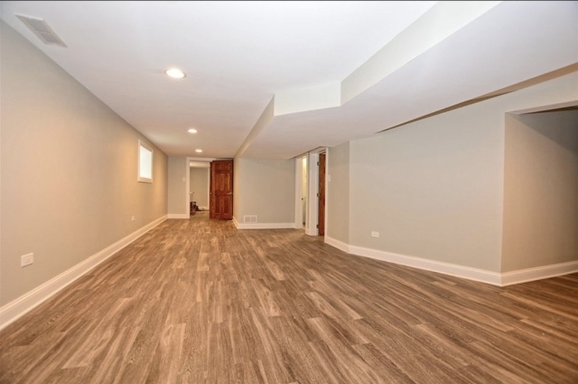 Undisclosed Address Chicago, IL 60628 - Photo 24 of 27 a view of an empty room with wooden floor