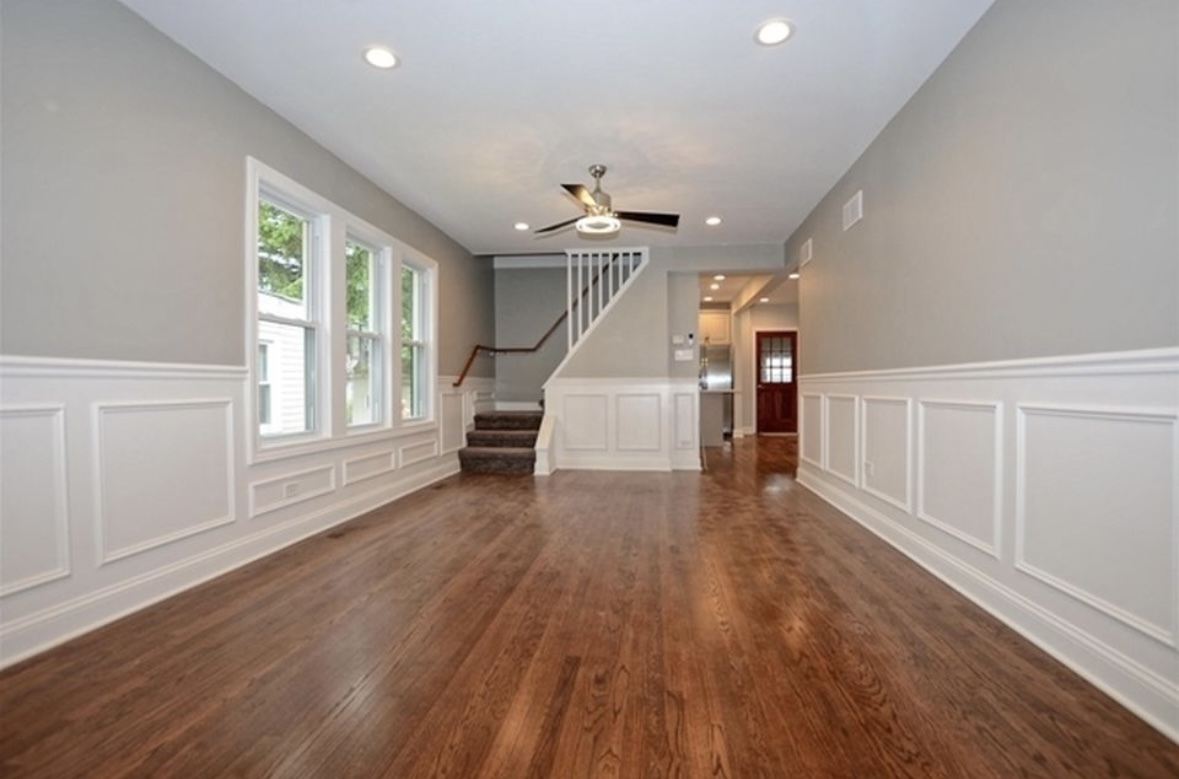 Undisclosed Address Chicago, IL 60628 - Photo 6 of 27 wooden floor in an empty room with a window