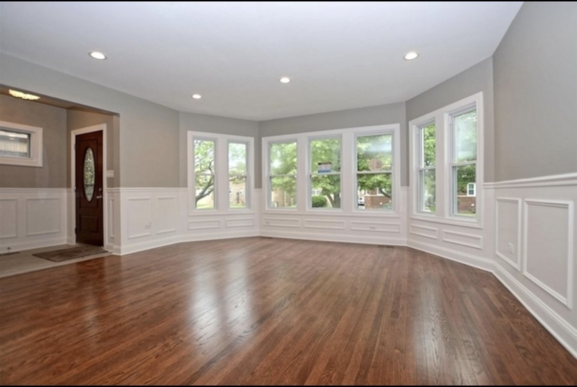 Undisclosed Address Chicago, IL 60628 - Photo 7 of 27 a view of an empty room with wooden floor and a window