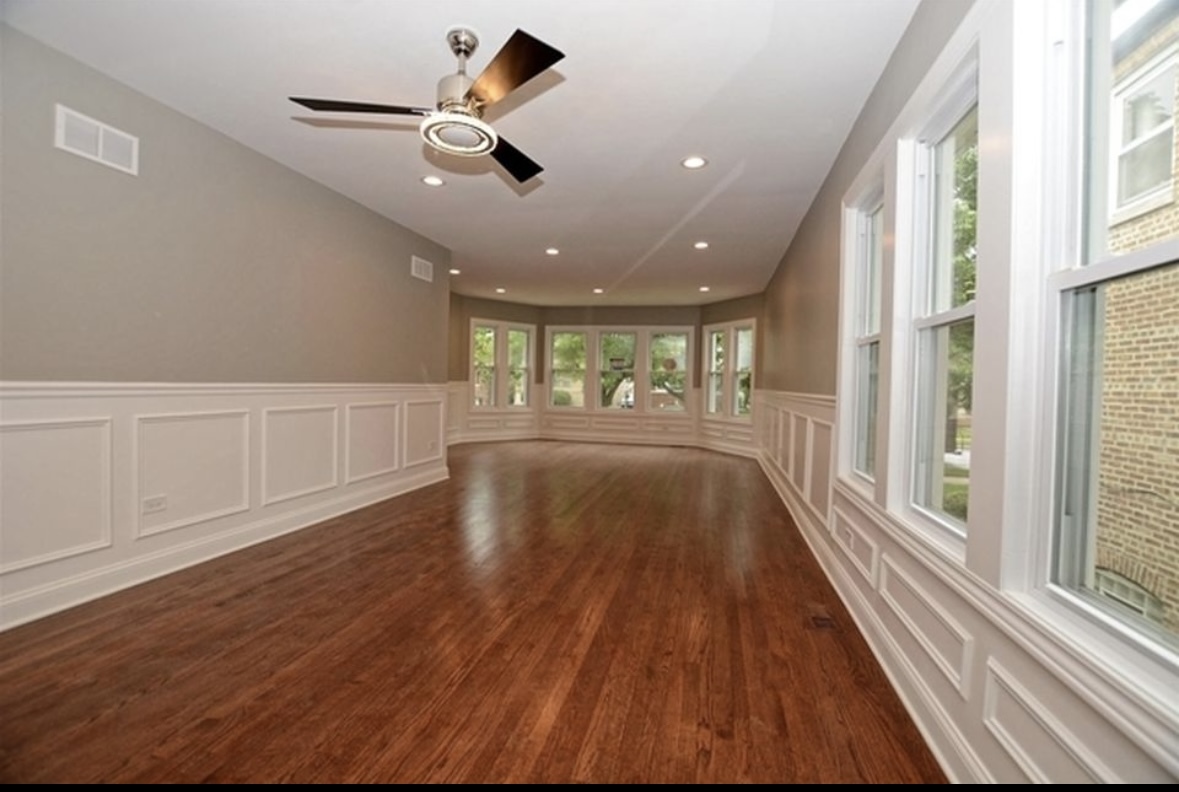 Undisclosed Address Chicago, IL 60628 - Photo 8 of 27 wooden floor in an empty room with a window