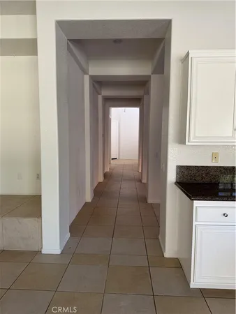 a kitchen with a sink a stove and cabinets