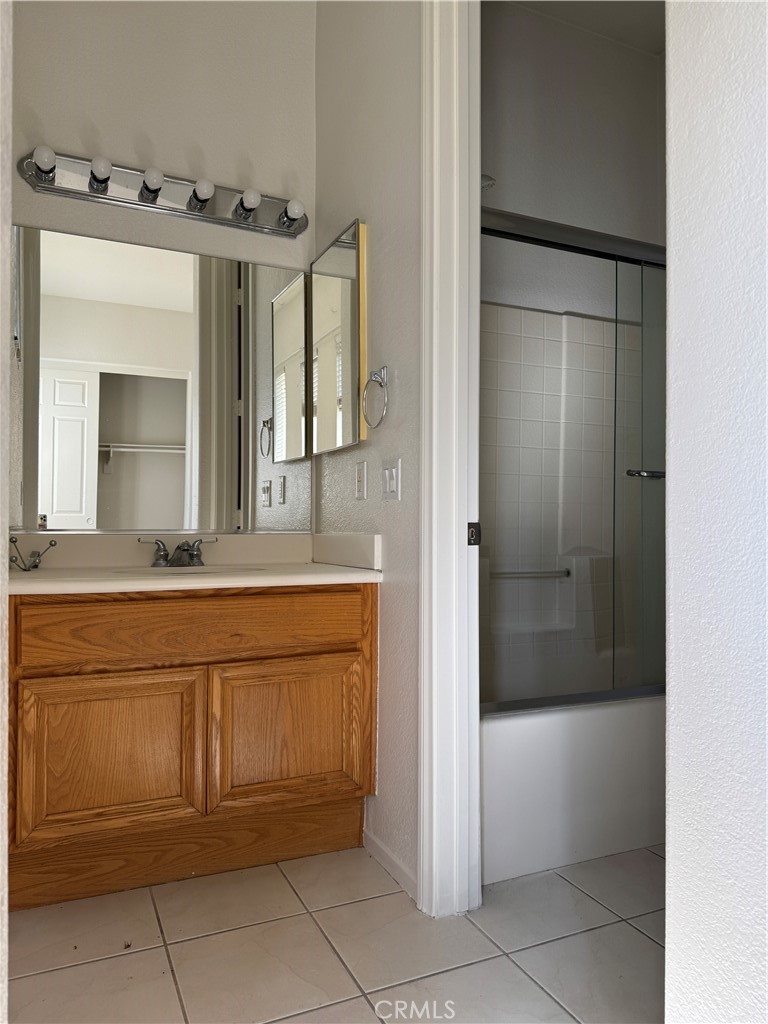 13628 Jeremy Court Rancho Cucamonga, CA 91739 - Photo 17 of 29 a bathroom with a bathtub sink and mirror