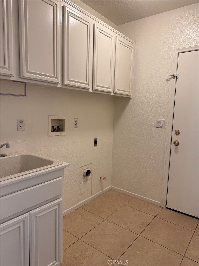 13628 Jeremy Court Rancho Cucamonga, CA 91739 - Photo 20 of 29 a utility room with cabinets washer and dryer