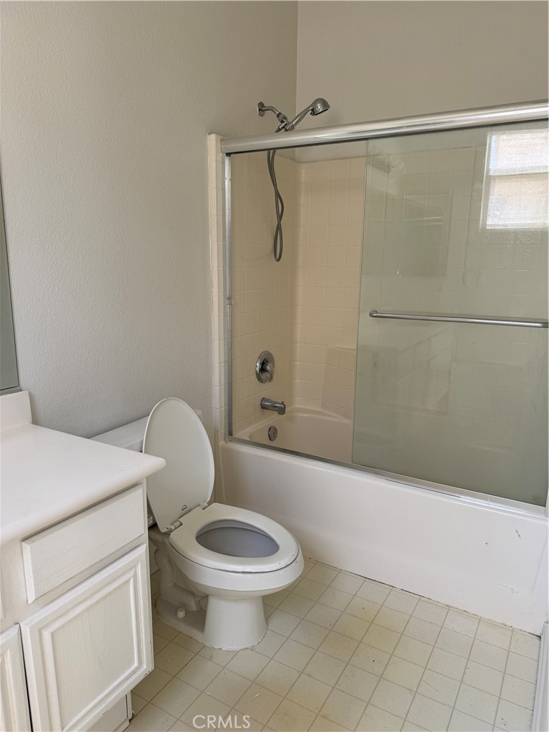 13628 Jeremy Court Rancho Cucamonga, CA 91739 - Photo 22 of 29 a white toilet and tub sitting next to a bathroom sink
