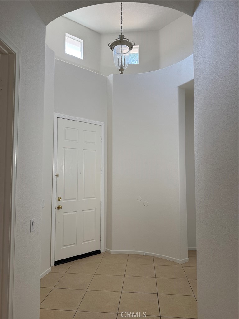 13628 Jeremy Court Rancho Cucamonga, CA 91739 - Photo 3 of 29 a view of a hallway with chandelier