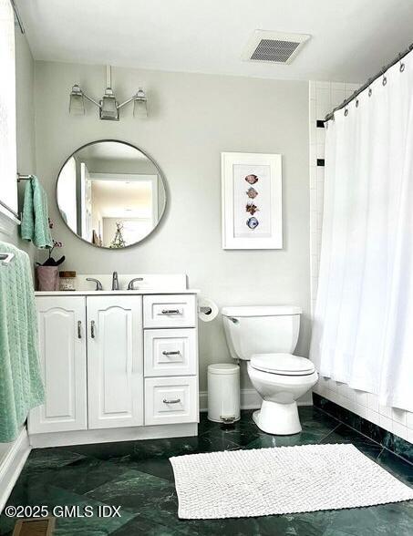6 Irvine Road Old Greenwich, CT 06870 - Photo 10 of 15 a bathroom with a toilet a sink and a mirror