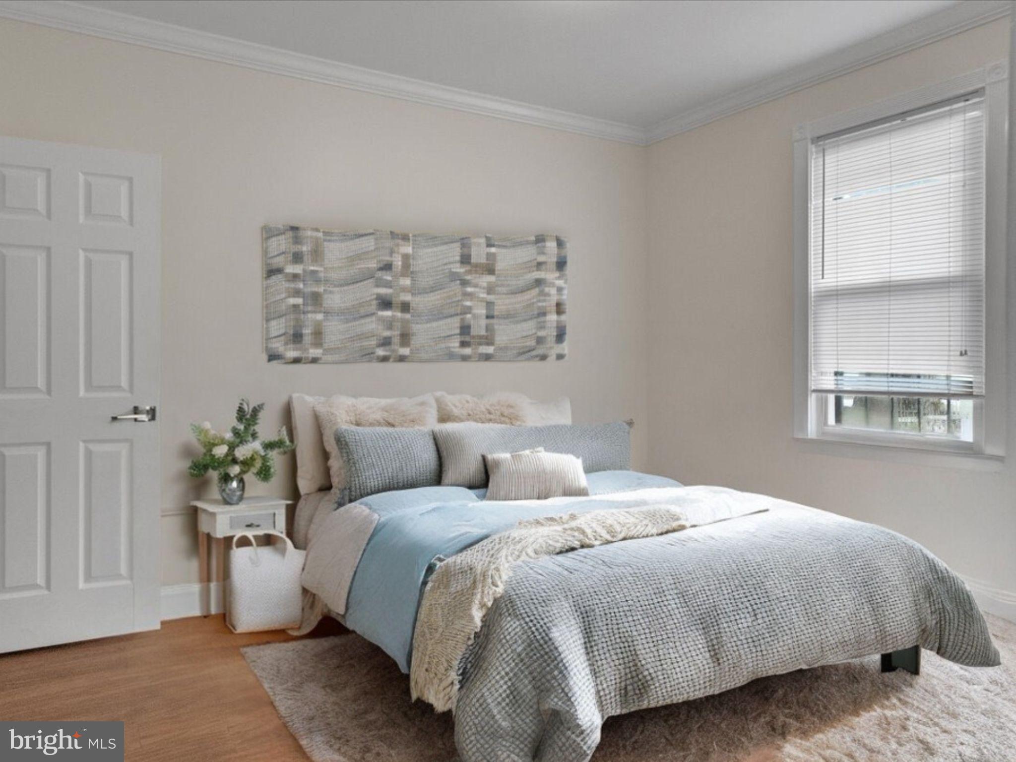 1707 Capitol Avenue Northeast, Unit 1 Washington, DC 20002 - Photo 6 of 10 a bedroom with a bed and a window