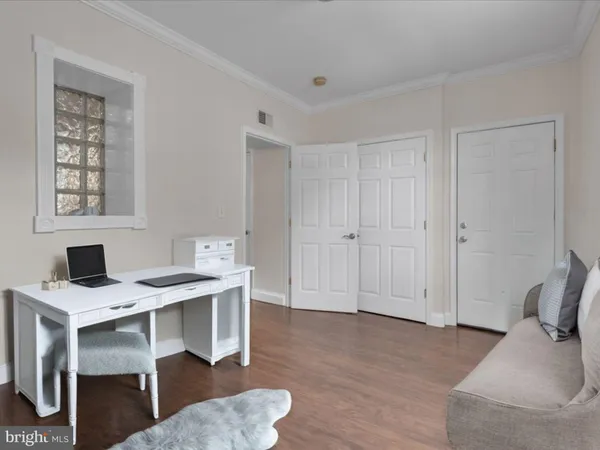 a workspace with furniture and window