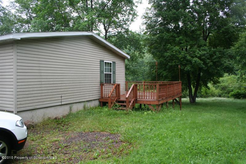 351 R Casterline Road Harveys Lake, PA 18618 - Photo 2 of 13 a view of a house with a yard and sitting area