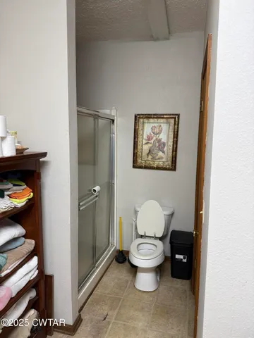 a white toilet sitting next to a bathroom sink