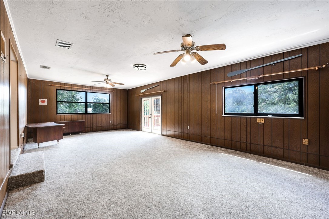 18191 Slater Road North Fort Myers, FL 33917 - Photo 20 of 34 a view of a livingroom with a ceiling fan and window