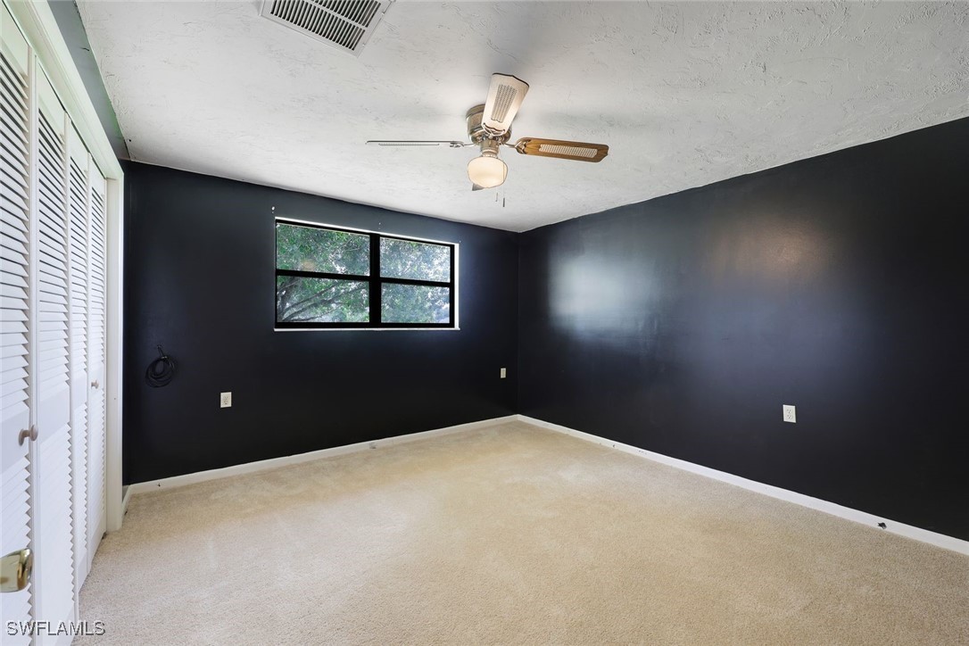 18191 Slater Road North Fort Myers, FL 33917 - Photo 26 of 34 an empty room with windows and closet