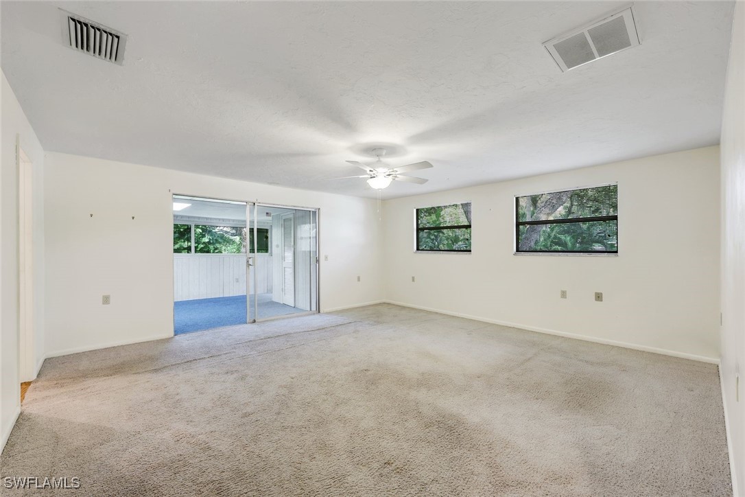 18191 Slater Road North Fort Myers, FL 33917 - Photo 27 of 34 an empty room with windows