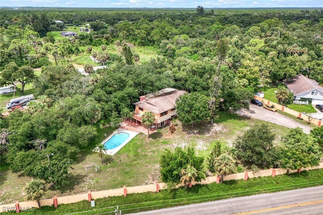 18191 Slater Road North Fort Myers, FL 33917 - Photo 3 of 34 an aerial view of residential houses with outdoor space and trees