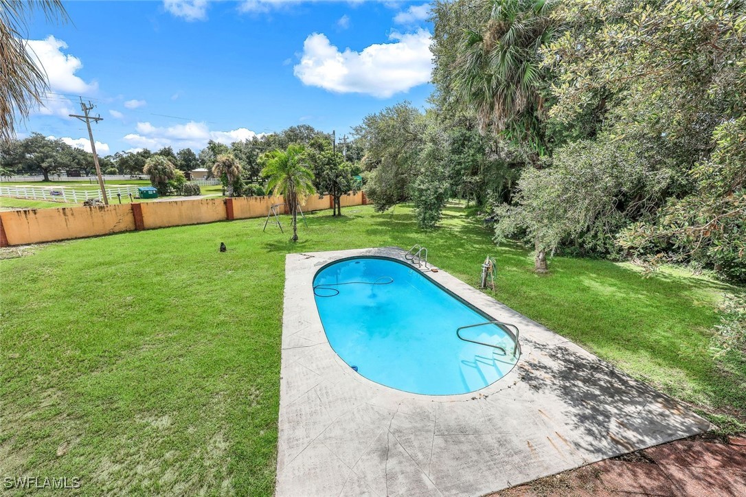 18191 Slater Road North Fort Myers, FL 33917 - Photo 7 of 34 a view of a garden with a slide