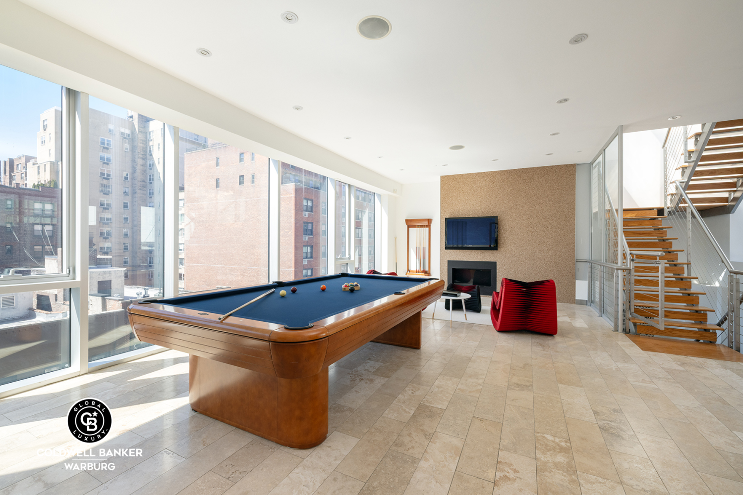 157 East 84th Street, Unit PH Manhattan, NY 10028 - Photo 11 of 17 a room with furniture and flat screen tv