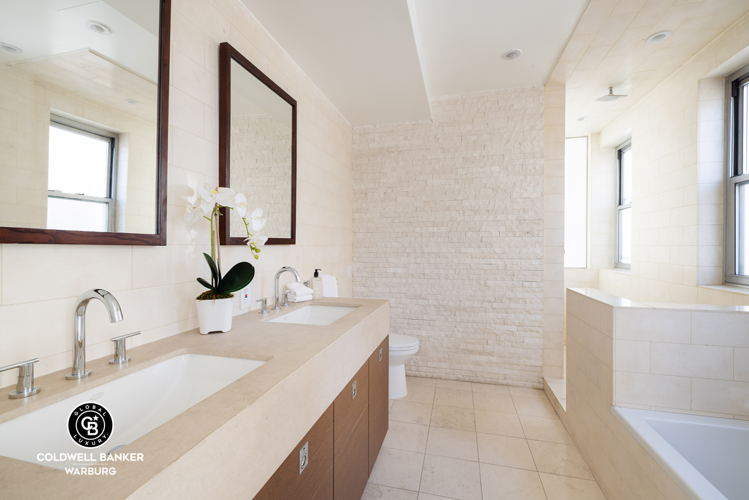 157 East 84th Street, Unit PH Manhattan, NY 10028 - Photo 13 of 17 a bathroom with a sink and a mirror