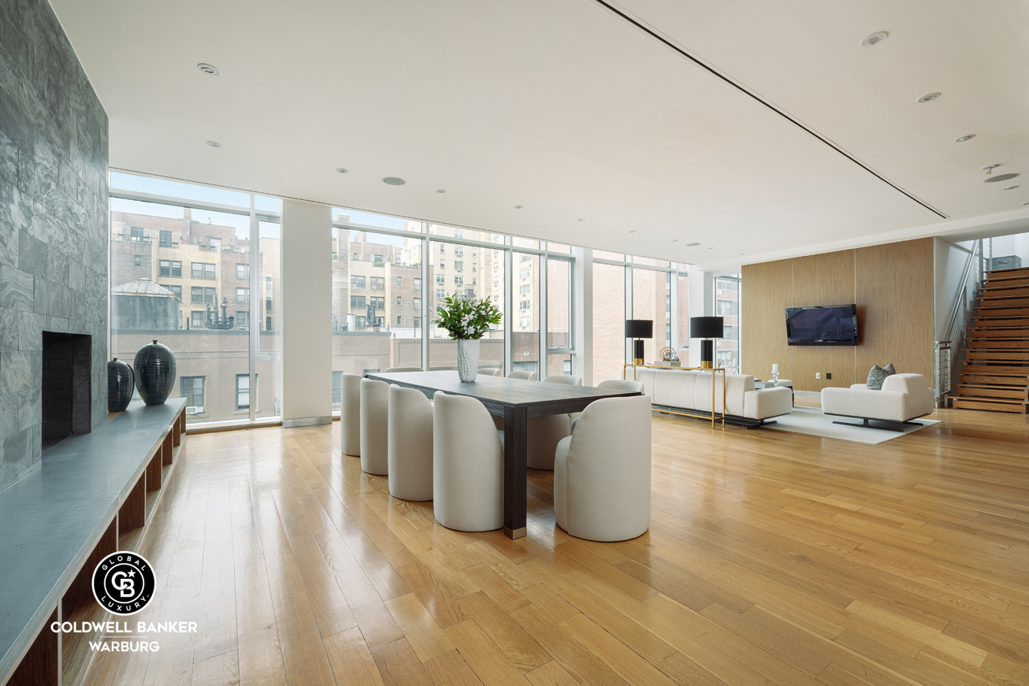 157 East 84th Street, Unit PH Manhattan, NY 10028 - Photo 2 of 17 a living room with fireplace furniture and a flat screen tv