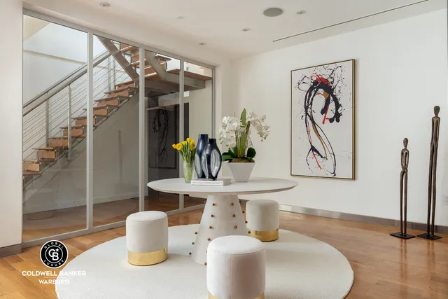 a kitchen with stainless steel appliances granite countertop a sink a stove a refrigerator and cabinets