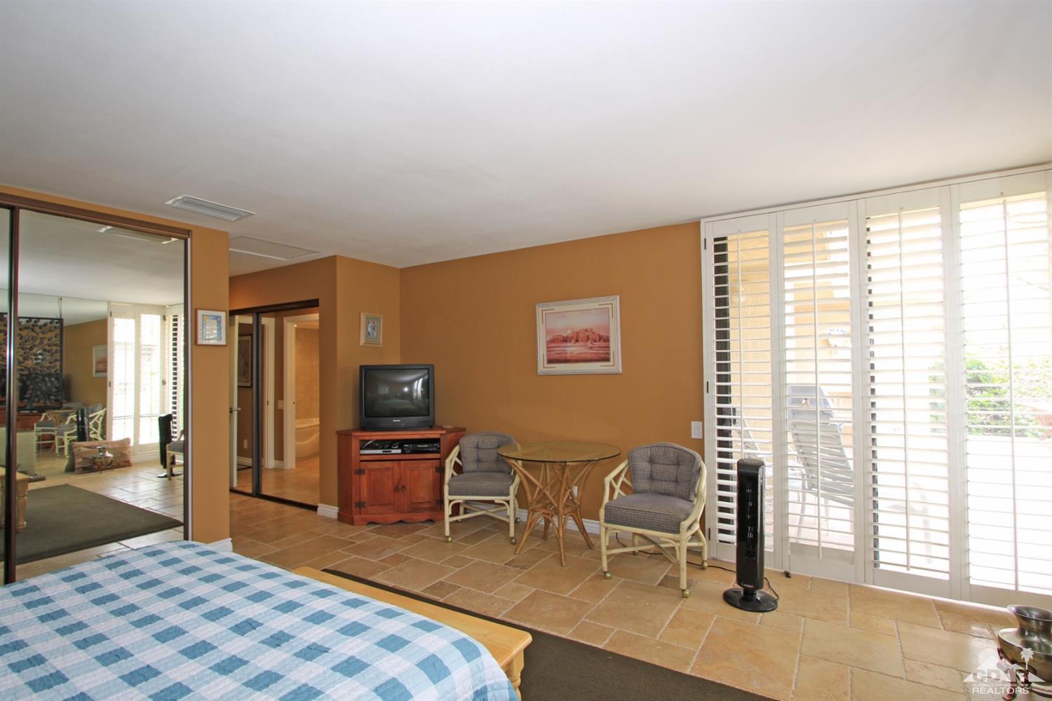 72350 Rodeo Way Rancho Mirage, CA 92270 - Photo 18 of 44 a bedroom with a bed and furniture