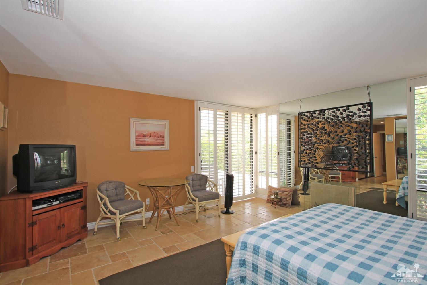 72350 Rodeo Way Rancho Mirage, CA 92270 - Photo 19 of 44 a bedroom with a bed and furniture