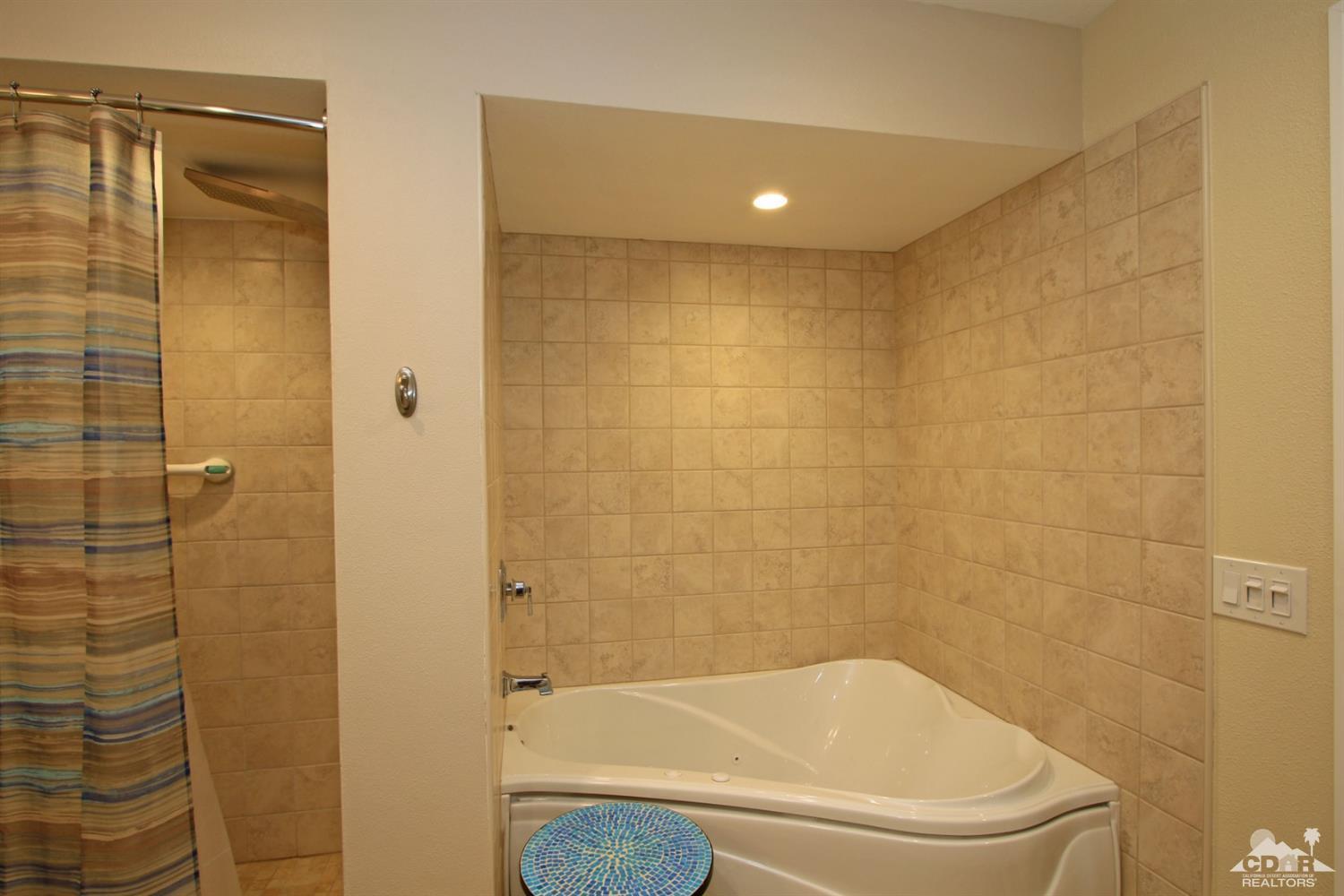 72350 Rodeo Way Rancho Mirage, CA 92270 - Photo 20 of 44 a bathroom with a bathtub and shower