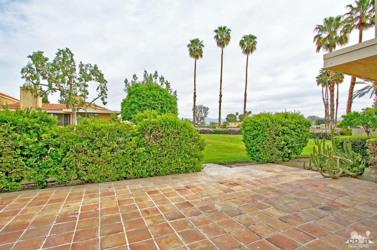 72350 Rodeo Way Rancho Mirage, CA 92270 - Photo 28 of 44 a view of a garden with a building in the background