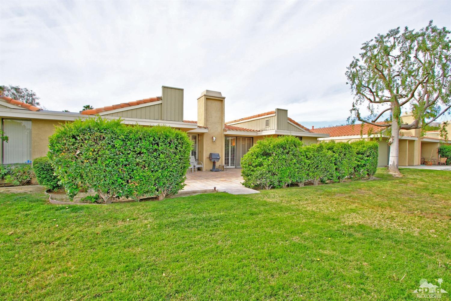 72350 Rodeo Way Rancho Mirage, CA 92270 - Photo 29 of 44 a view of a garden with a building in the background
