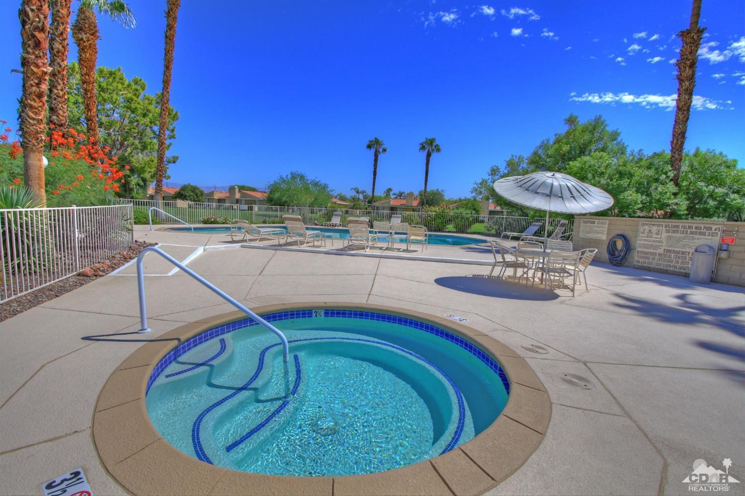72350 Rodeo Way Rancho Mirage, CA 92270 - Photo 40 of 44 a view of a swimming pool with a patio and a yard