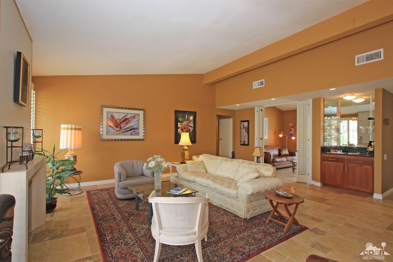 72350 Rodeo Way Rancho Mirage, CA 92270 - Photo 5 of 44 a living room with furniture and a table