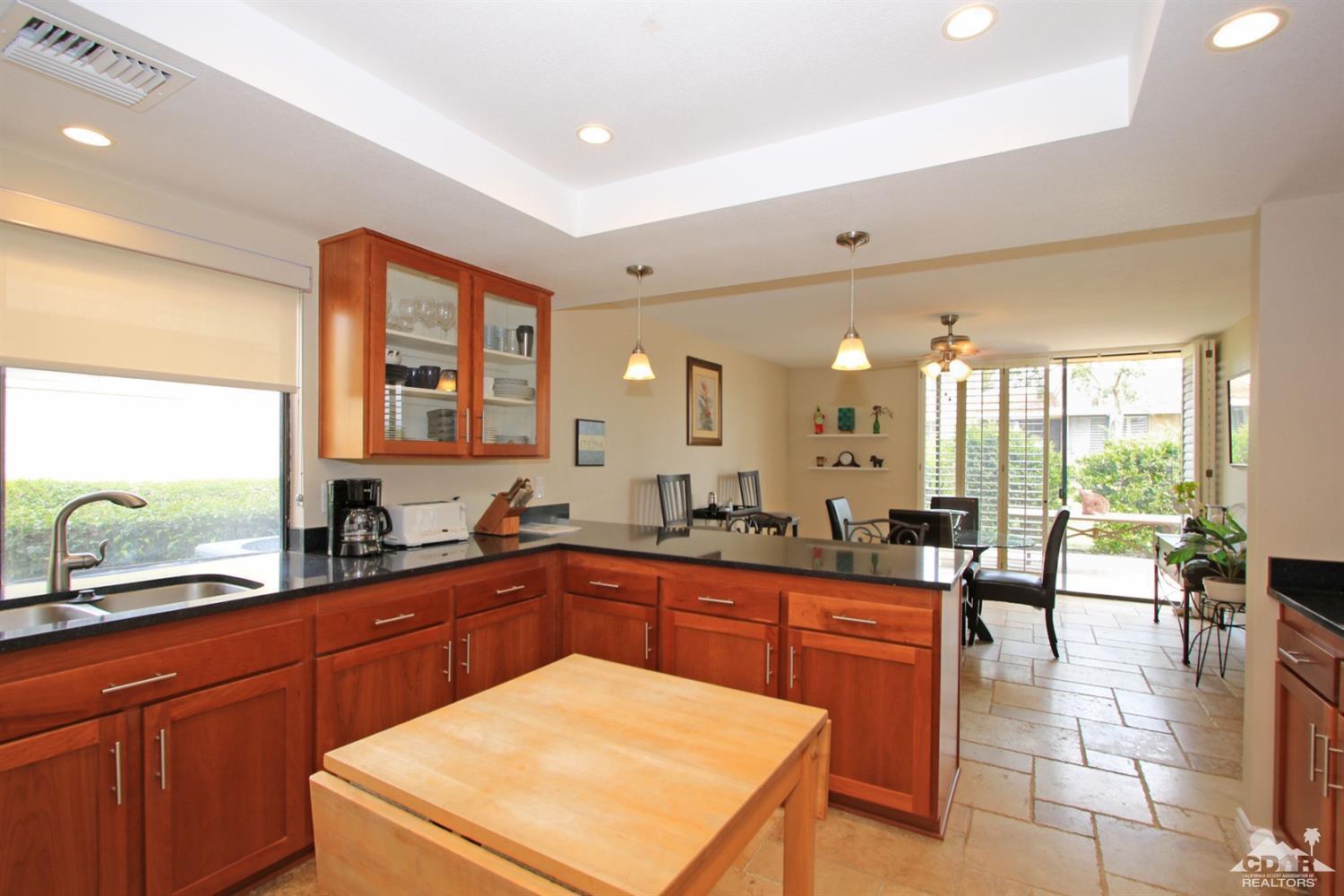 72350 Rodeo Way Rancho Mirage, CA 92270 - Photo 10 of 44 a large kitchen with lots of counter space and a sink