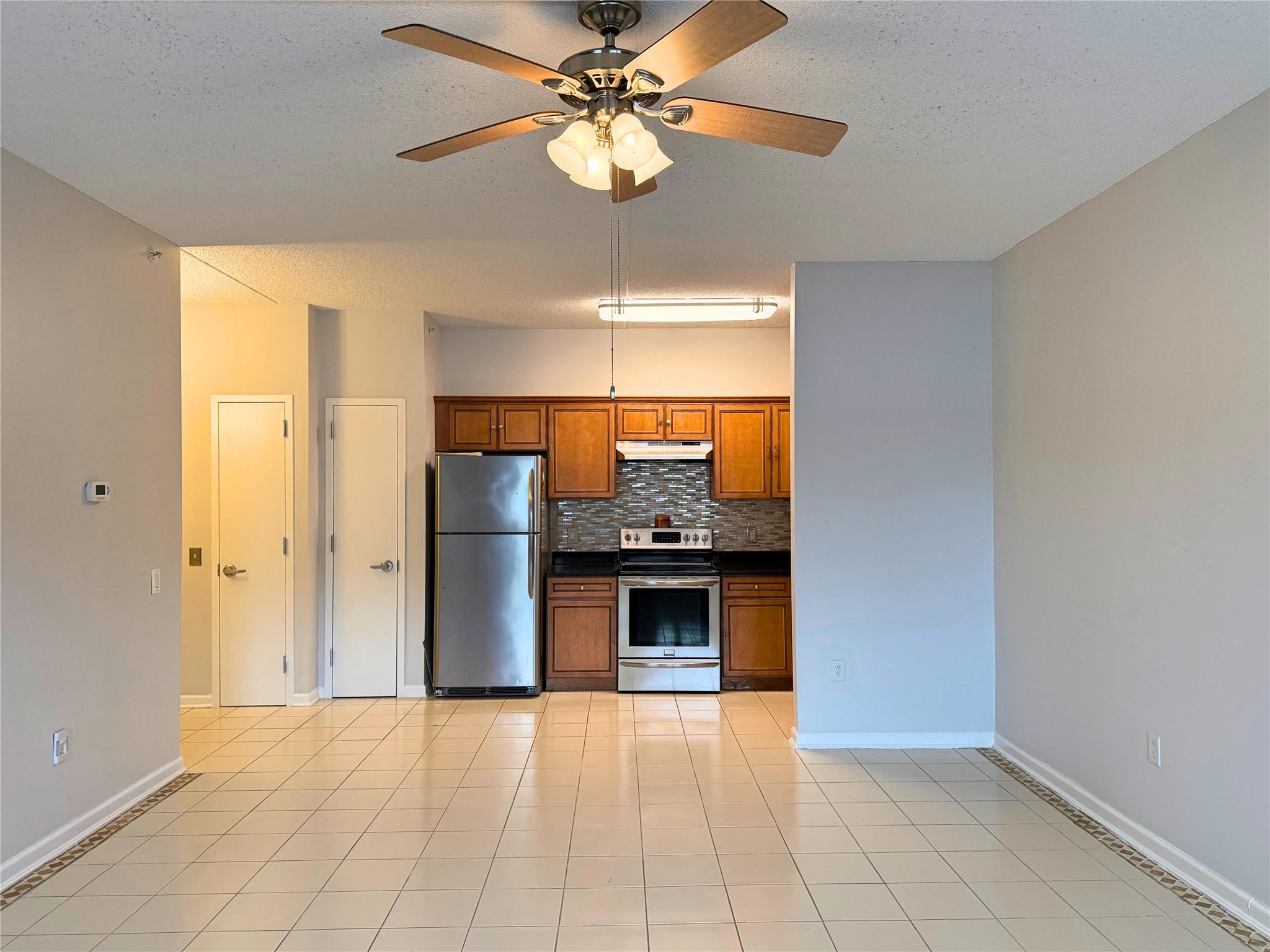 260 Beach 81st Street, Unit 1D Queens, NY 11693 - Photo 1 of 17 a view of a kitchen with a cabinet and a fireplace