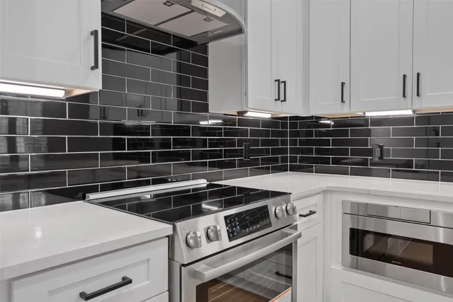 a view of appliances and cabinets